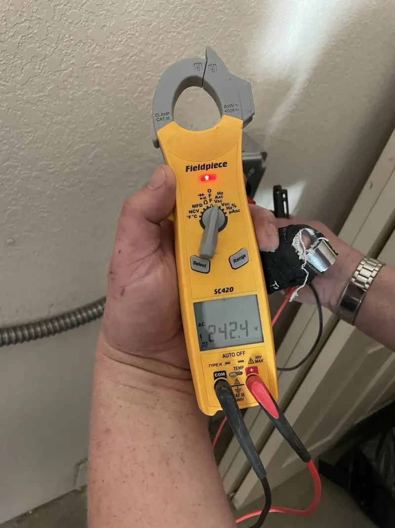 Voltage testing with clamp meter during Ceiling Fan Installation in Mexico